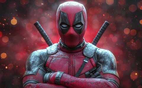 Fond d'écran Deadpool 4K avec pose de bras croisés, effets bokeh rouges et éclairage dramatique, arrière-plan Ultra HD portrait pour ordinateur de bureau et mobile