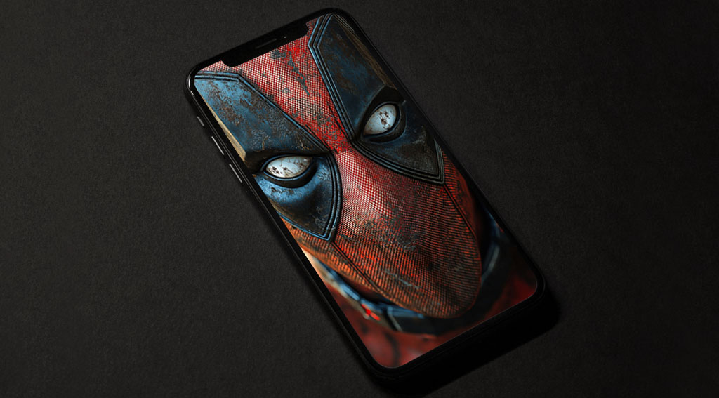 Fond d'écran gratuit Deadpool 4K en gros plan d'un masque rouge et noir avec des yeux blancs, disponible en résolution HD pour ordinateur de bureau et mobile