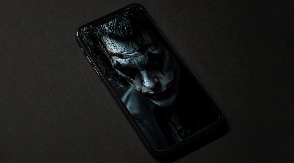 Dramatic Joker wallpaper in rain with blue lighting effects showing detailed makeup and wet hair, available in HD and 4K resolution