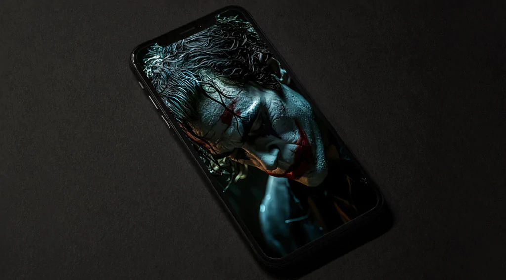 Dark moody Joker wallpaper 4K with dramatic lighting in classic makeup against black background with rain effect, available in HD and resolution