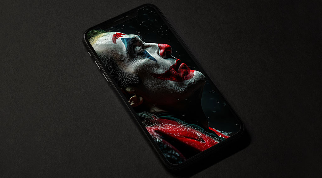 Fond d'écran gratuit Joaquin Phoenix Joker 4K en maquillage dramatique avec des flocons de neige, disponible en haute résolution Ultra HD pour ordinateur de bureau et mobile.