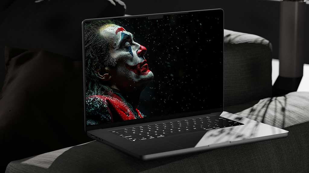 Fond d'écran gratuit Joaquin Phoenix Joker 4K en maquillage dramatique avec des flocons de neige, disponible en haute résolution Ultra HD pour ordinateur de bureau et mobile.