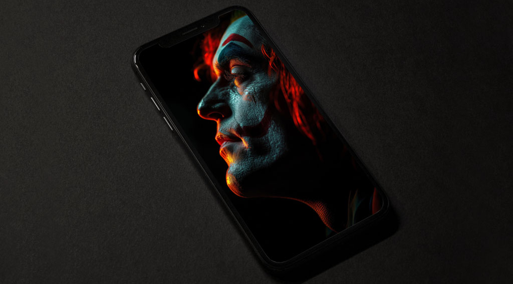 Joaquin Phoenix fond d'écran Joker gratuit 4k éclairage orange et vert sur son visage, ultra HD pour bureau et mobile