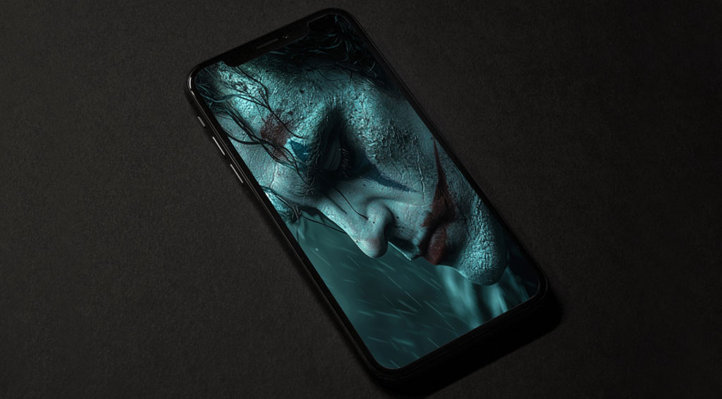 Fond d'écran profilé Joker atmosphérique avec effets de pluie, textures lumineuses et ambiance lunatique, disponible en HD et 4K