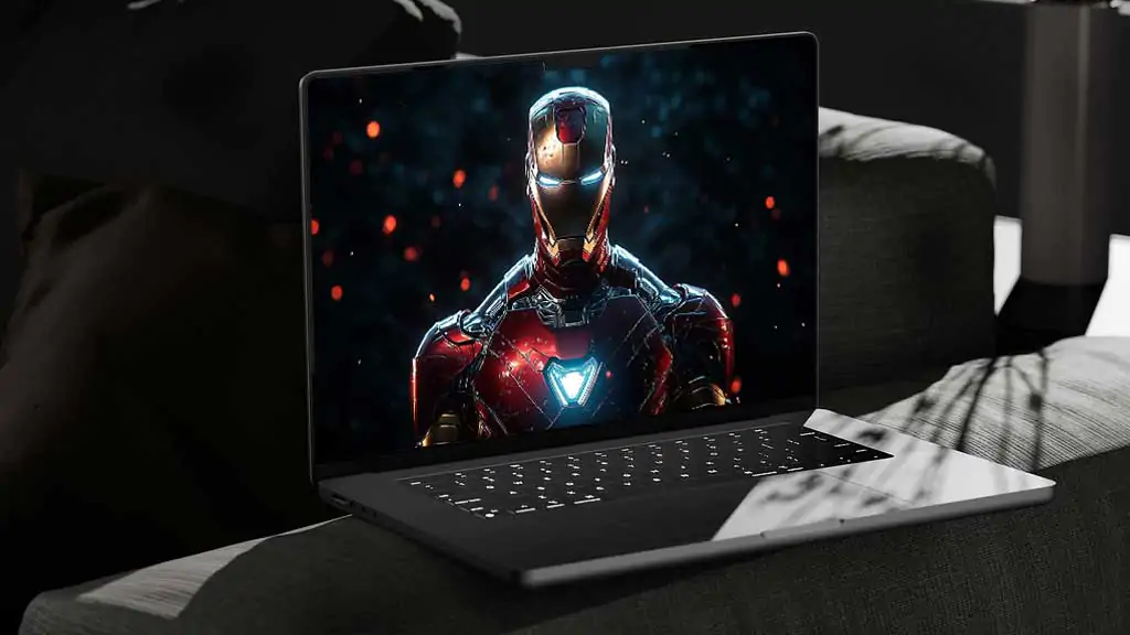 Iron Man dans une pose héroïque avec un réacteur à arc rougeoyant sur un fond sombre et enflammé, disponible en tant que fond d'écran 4K Ultra HD pour les ordinateurs de bureau et les appareils mobiles.