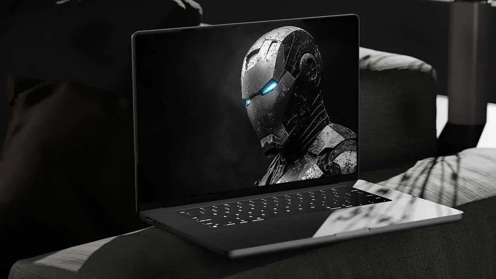 Black and white Iron Man armor wallpaper with blue glowing eyes in noir style, featuring battle-worn textures in 4K Ultra HD for laptop