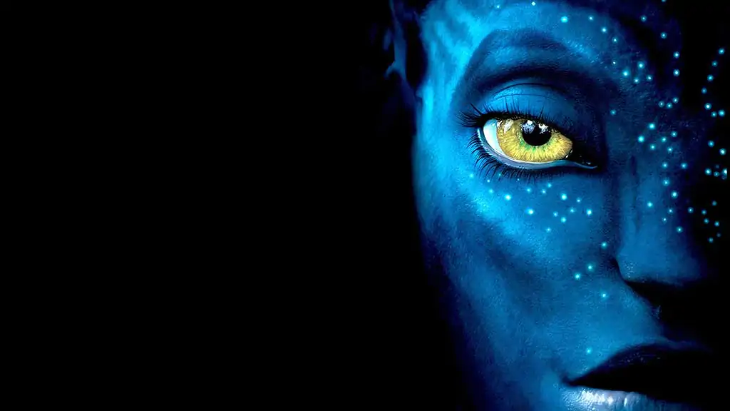 Avatar 4K HD movie poster wallpaper 4k showing close-up of blue Na'vi character with golden eyes and glowing skin patterns Free download