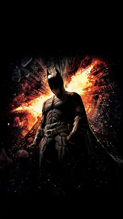 Batman The Dark Knight Rises 4K wallpaper showing hero against exploding Gotham City skyscrapers Ultra HD background Free Download