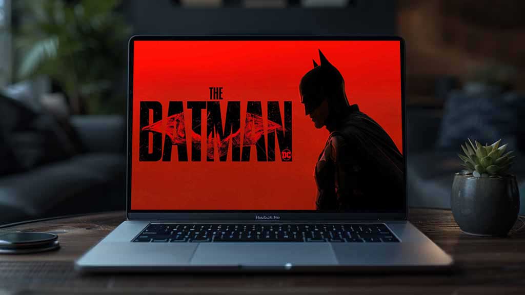 The Batman red logo 4K wallpaper showing Dark Knight silhouette with cracked title text ultra HD background free download