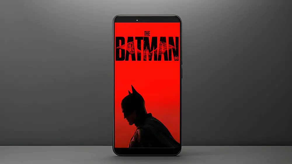 The Batman red logo 4K wallpaper showing Dark Knight silhouette with cracked title text ultra HD background free download