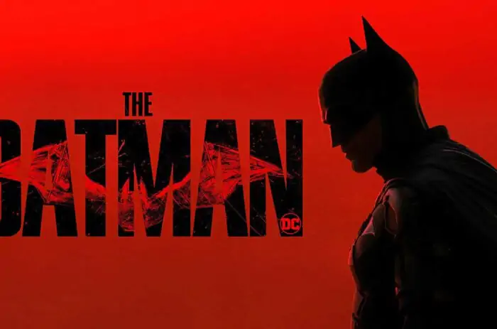 The Batman red logo 4K wallpaper showing Dark Knight silhouette with cracked title text ultra HD background free download