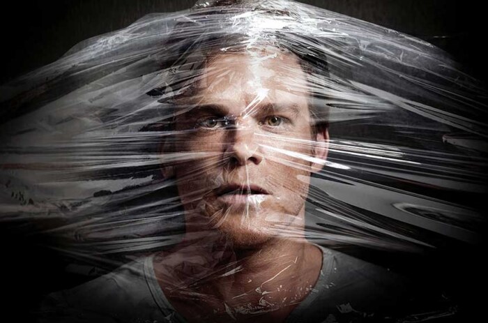 Dexter 4K wallpaper featuring TV series character with dramatic plastic wrap artistic effect and intense lighting against dark background